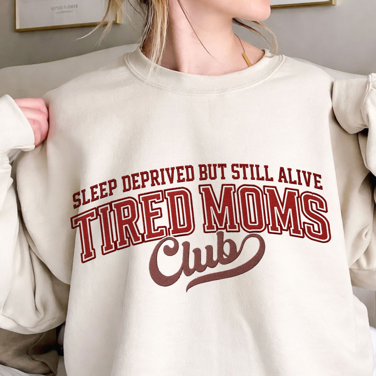 Tired Moms Club embroidered pet crewneck sweatshirt.