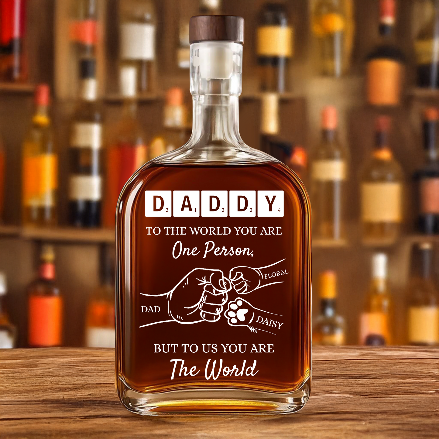 Personalized whiskey bottle with custom engraving that reads "To Your Family You Are The World, Our Family."