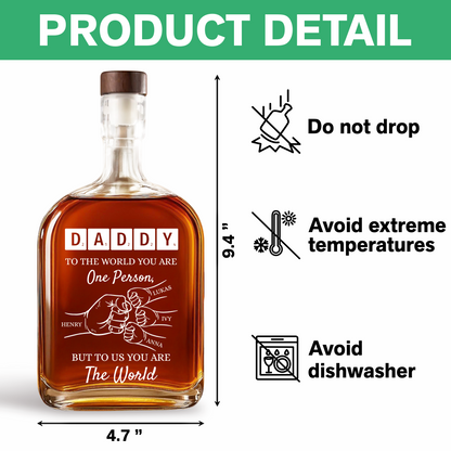 Personalized whiskey bottle with custom engraving that reads "To Your Family You Are The World, Our Family."