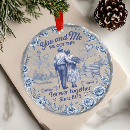 Personalized glass ornament with "You, Me, We Got This" for anniversary gifts.